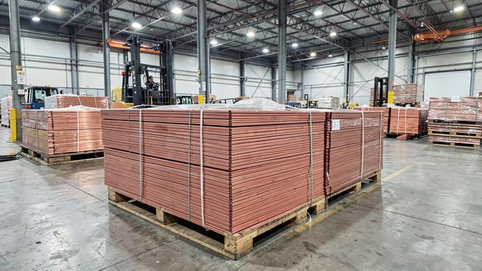 Copper cathode bundles stored in a warehouse ahead of export